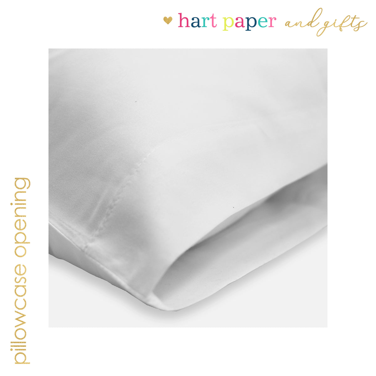 A close-up view of a white pillowcase, with the text "hart paper and gifts" written above it.
